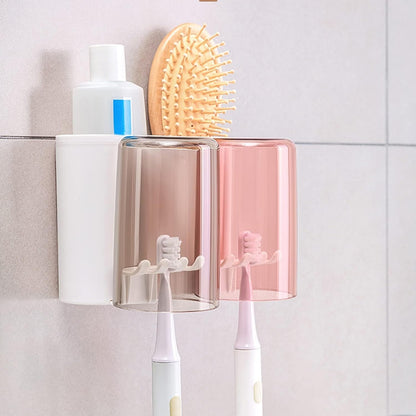 Wall-mounted bathroom organizer with toothbrush and toothpaste holder.