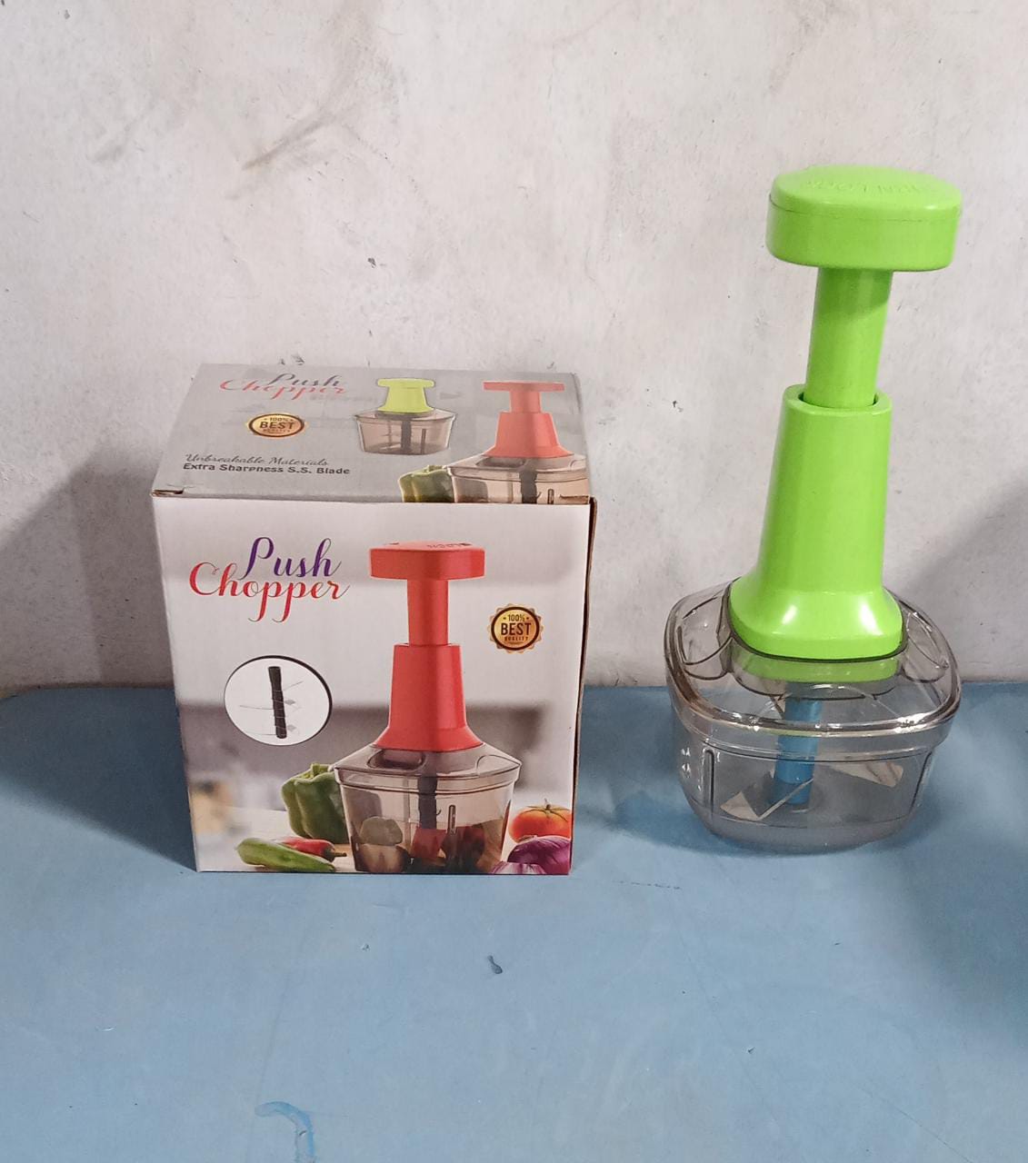 Manual food chopper with three stainless steel blades